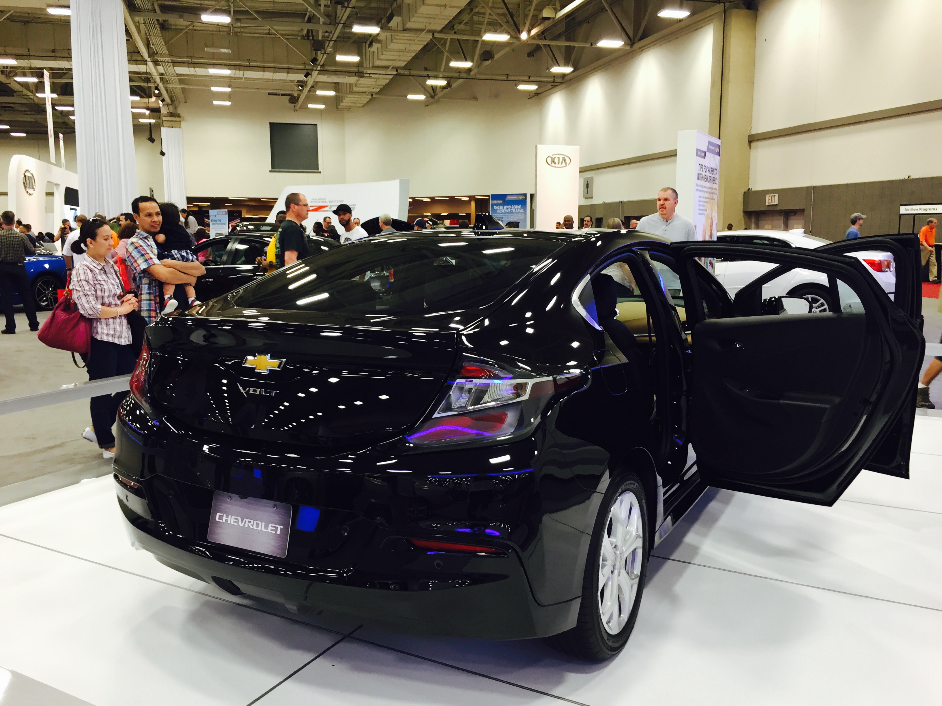 Visitors check out a Chevrolet Volt at last year’s auto show.